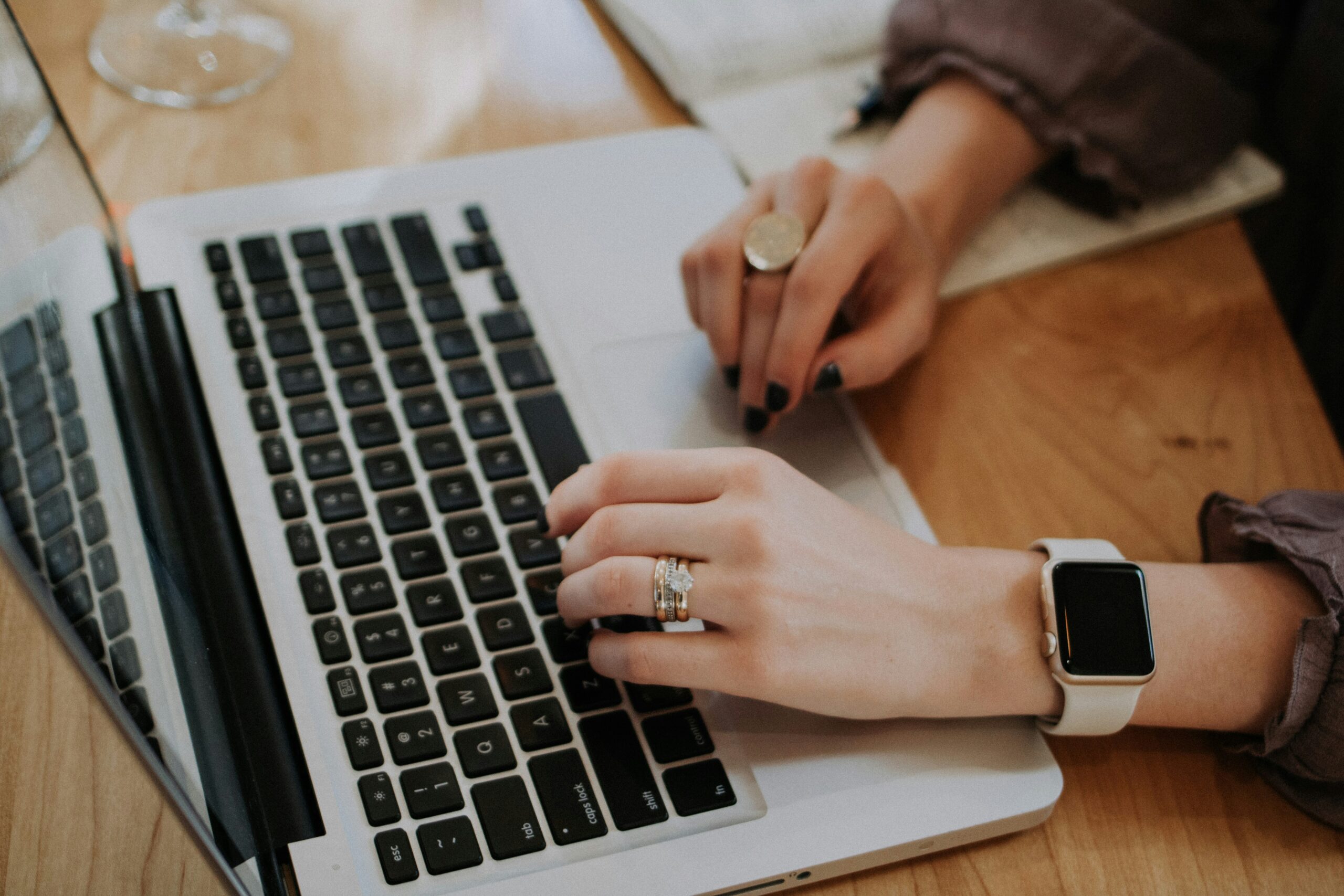 Blogger tracking affiliate link clicks and traffic numbers on a laptop